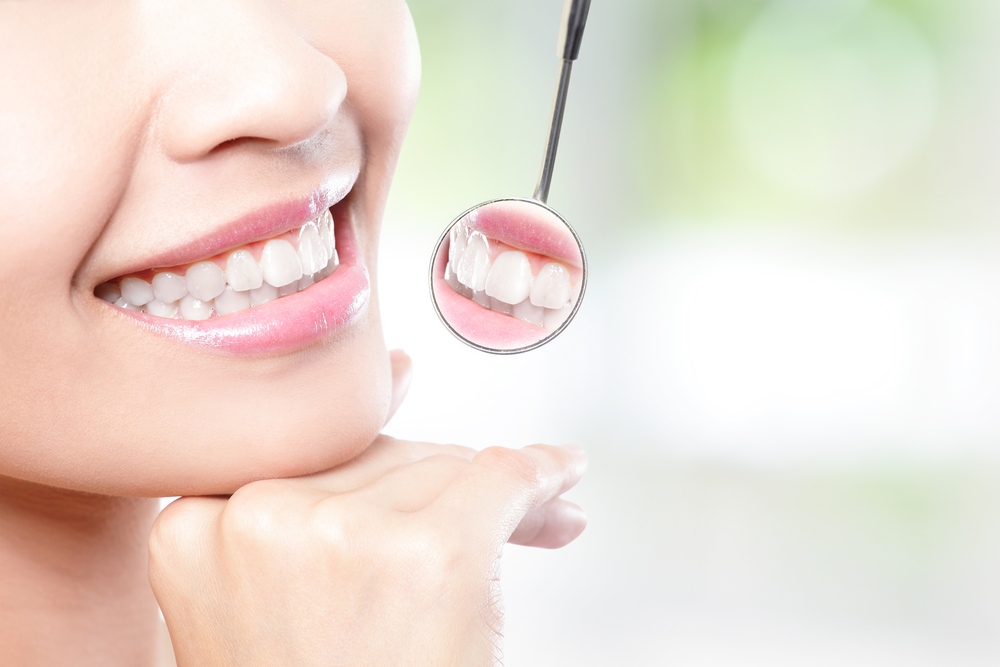 Closeup shot of woman's toothy smile stock photo