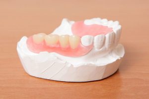 acrylic denture (False teeth) on the table stock photo