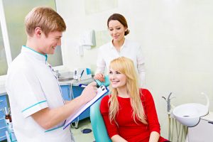 Doctor taking patient notes history stock photo